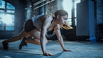 Athletic Beautiful Woman Does Running Plank as Part of Her Cross Fitness, Bodybuilding Gym Training Routine. Image-1105